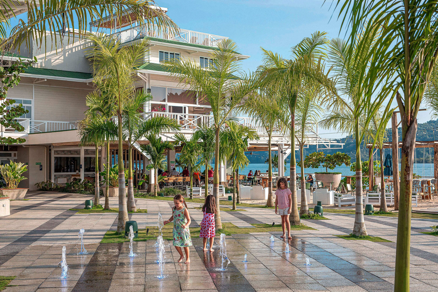 Families at Marina Village fountain plaza, Marina Bahía Golfito