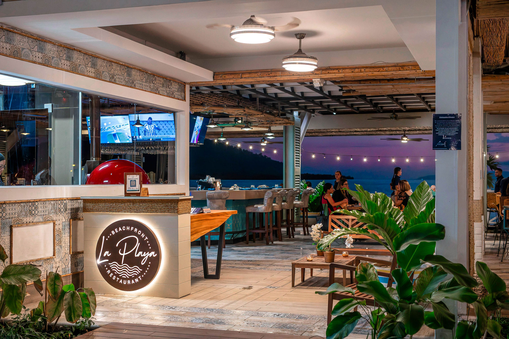 La Playa Beachfront Restaurant at Marina Bahía Golfito — waterfront dining at night