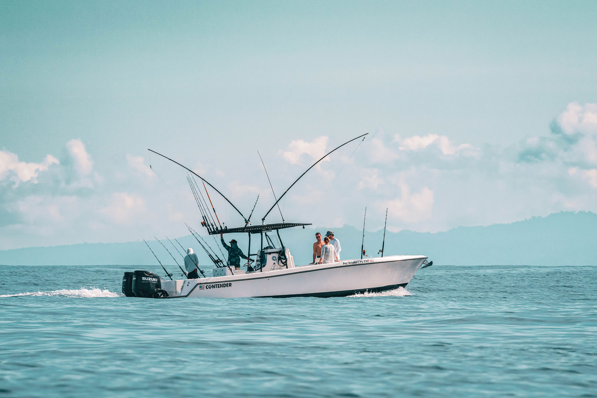 Sportfishing boat with full rod spread running offshore from Golfito, Costa Rica