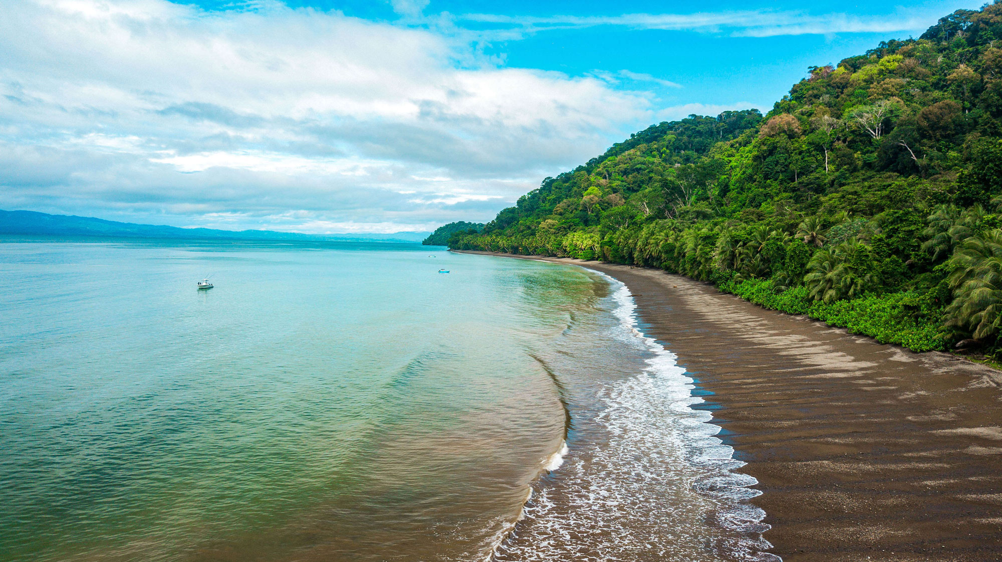 Aerial view of Southern Zone beach with boats offshore, Golfito Costa Rica