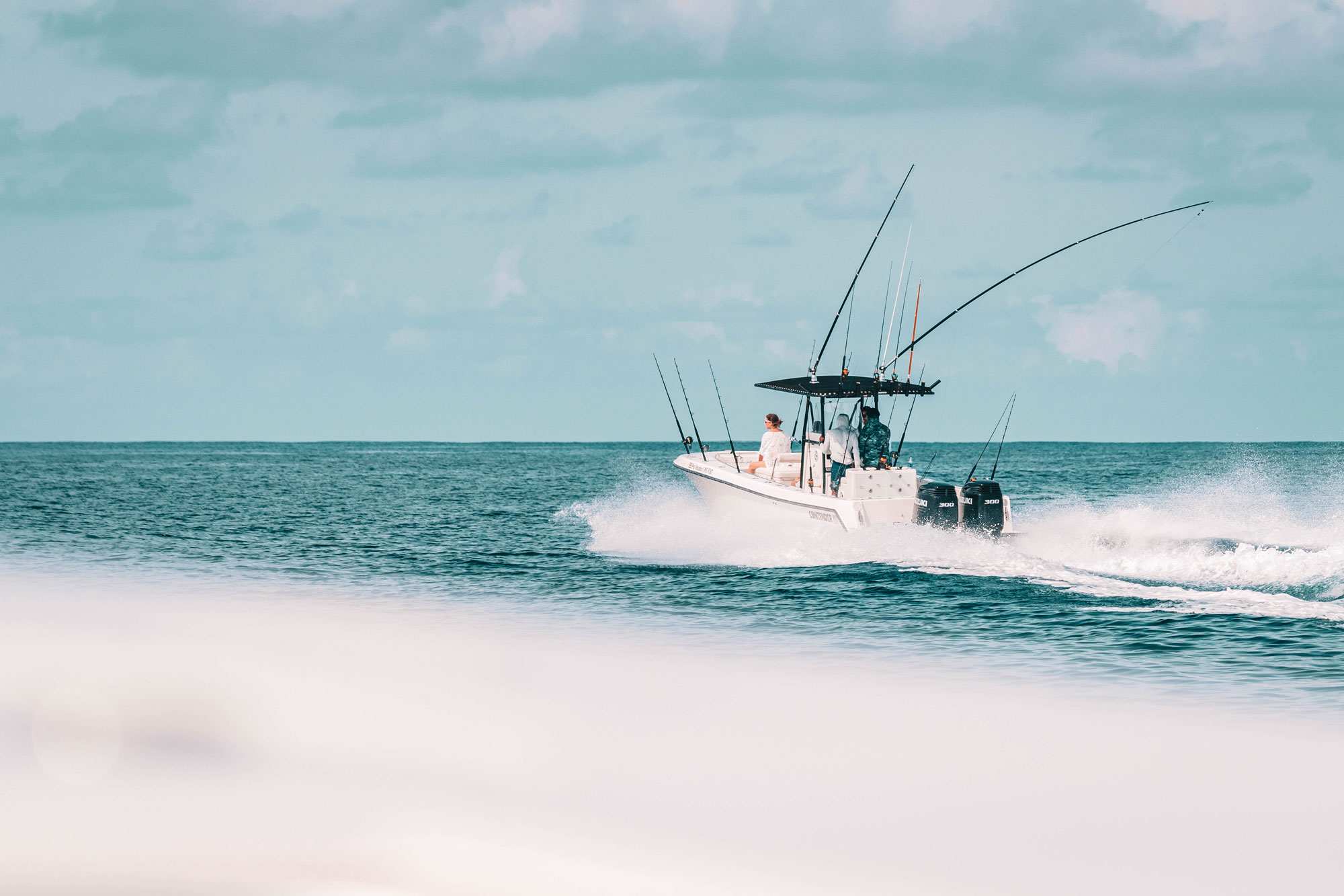 Sportfishing boat at speed with rods spread, Golfo Dulce Costa Rica