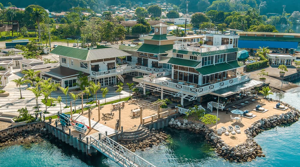 Aerial view of Marina Bahia Golfito and its green-roofed waterfront clubhouse on Costa Rica's Southern Pacific coast.
