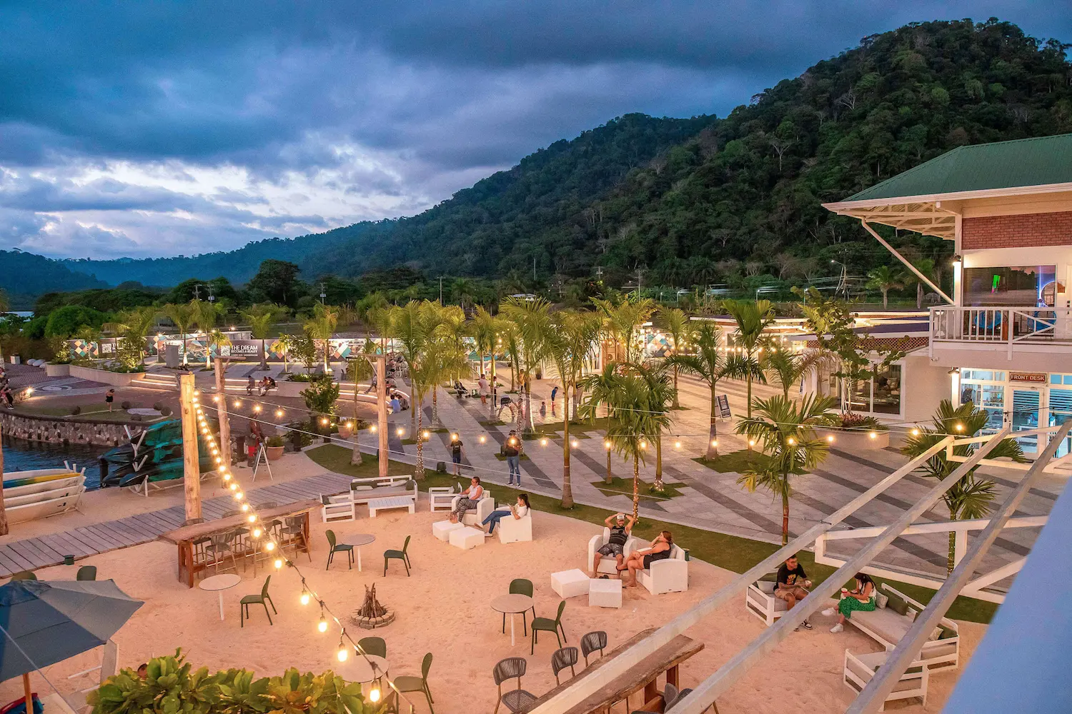 Boats moored at Marina Bahía Golfito with jungle backdrop