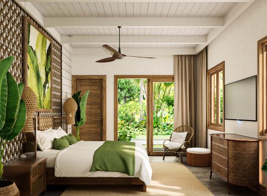 Model Home C master bedroom with woven rattan headboard, botanical art, and garden view, Sanctuary Boutique Residences
